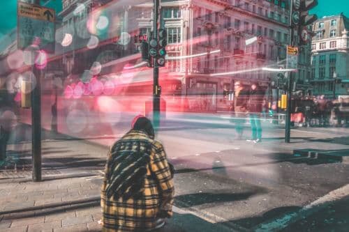 loneliness-epidemic-hooded-street
